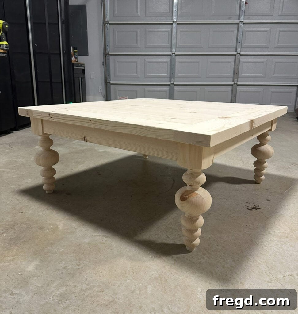 Applying wood stain to the prepared coffee table surface