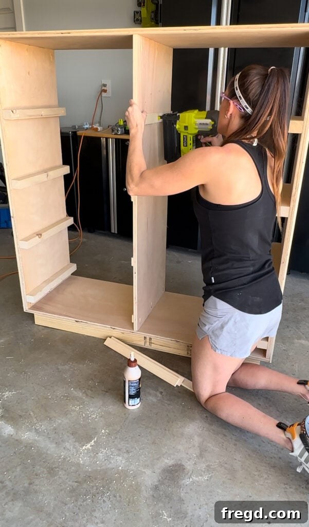 Craft Your Own Custom Dresser 14 Attaching inside drawer spacers within the dresser frame