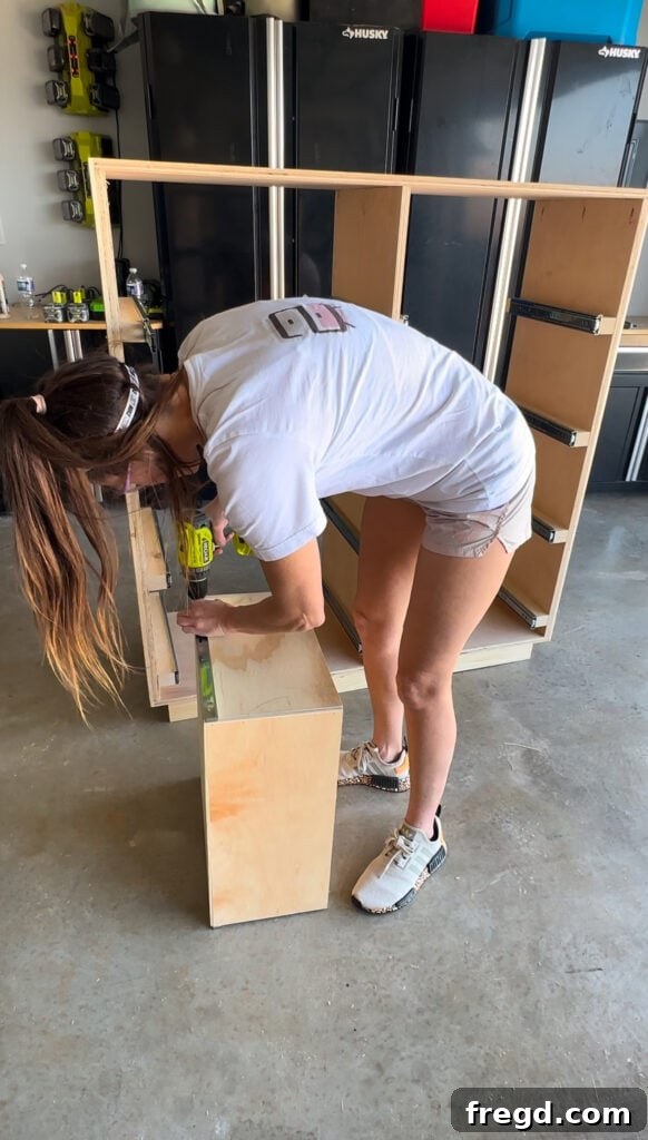 Craft Your Own Custom Dresser 19 Installing the second half of a drawer slide onto a drawer box