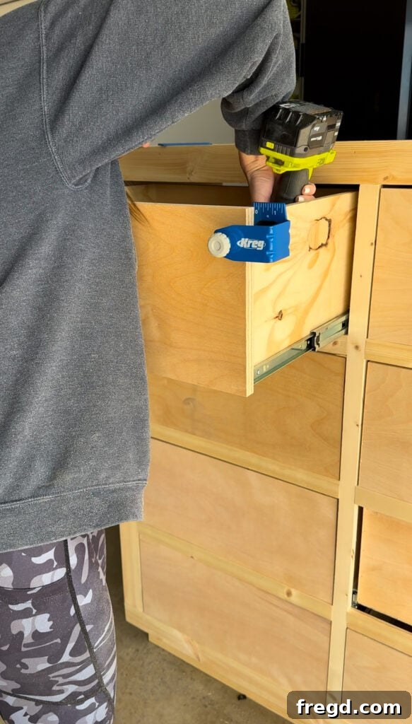 Craft Your Own Custom Dresser 27 Close-up of the Kreg Drawer Front Mounting Jig in use