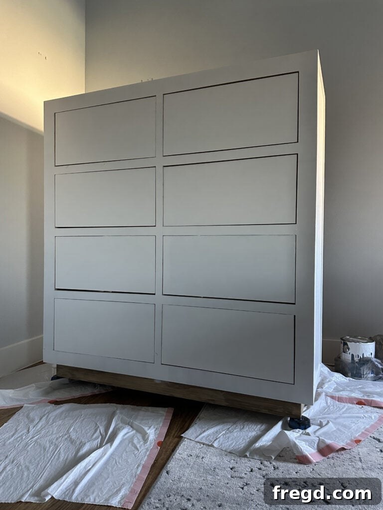 Craft Your Own Custom Dresser 30 Painting the DIY dresser a bright white