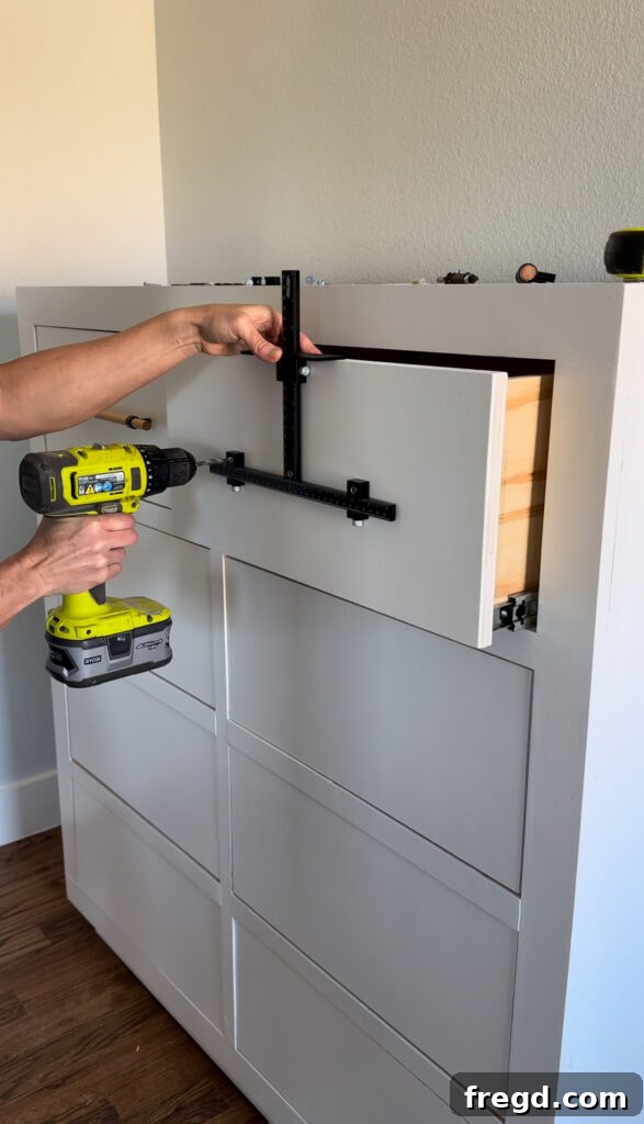 Craft Your Own Custom Dresser 32 Marking the drill points for the drawer pulls with the Kreg jig