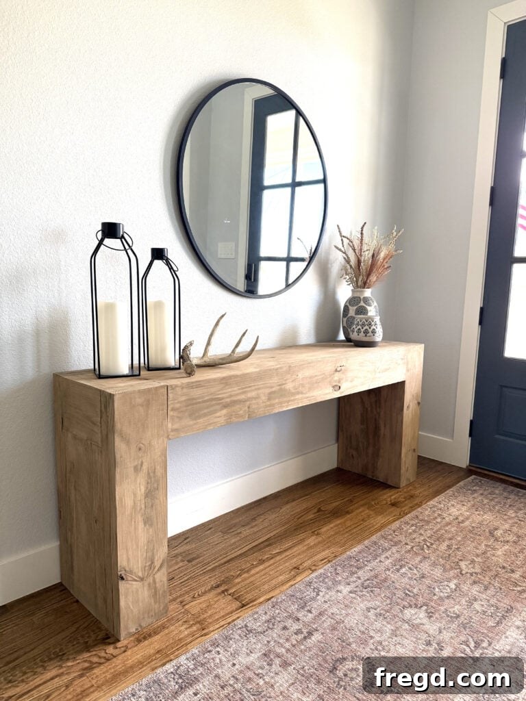 Decorated entryway with console table and mirror
