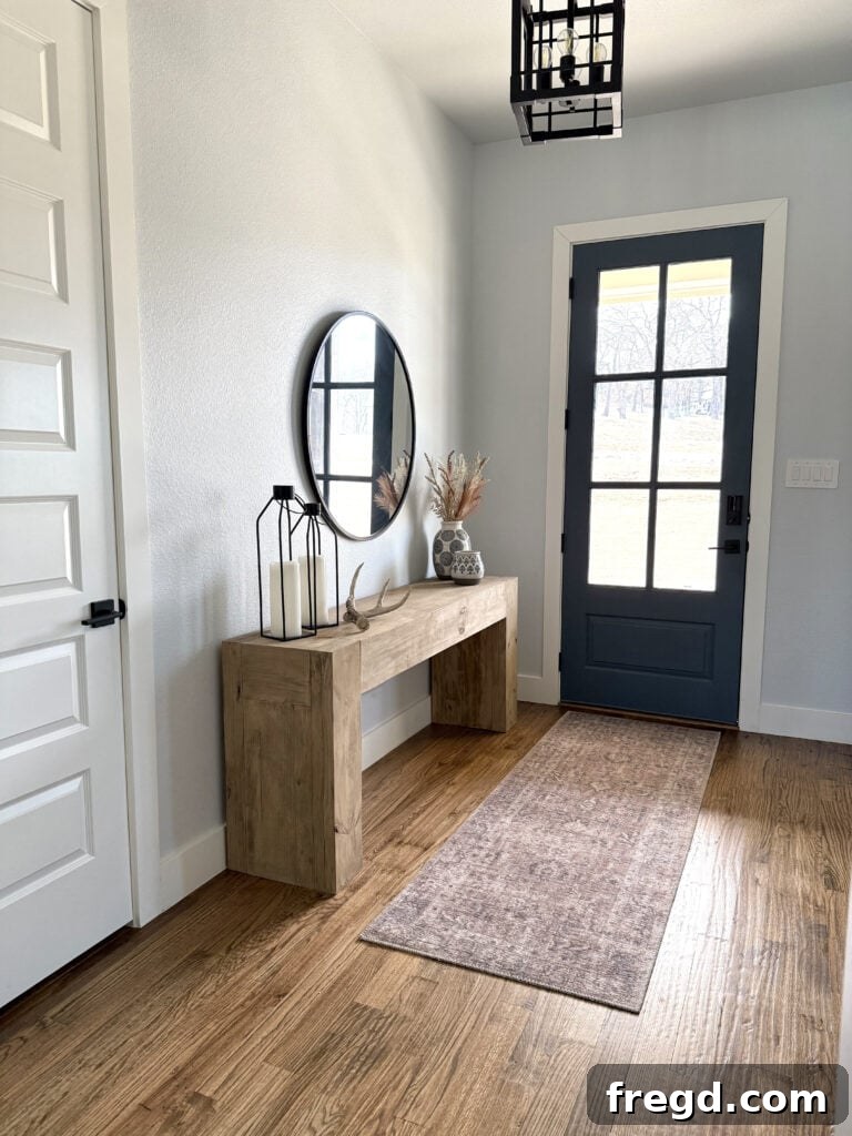 Full view of decorated entryway with console table