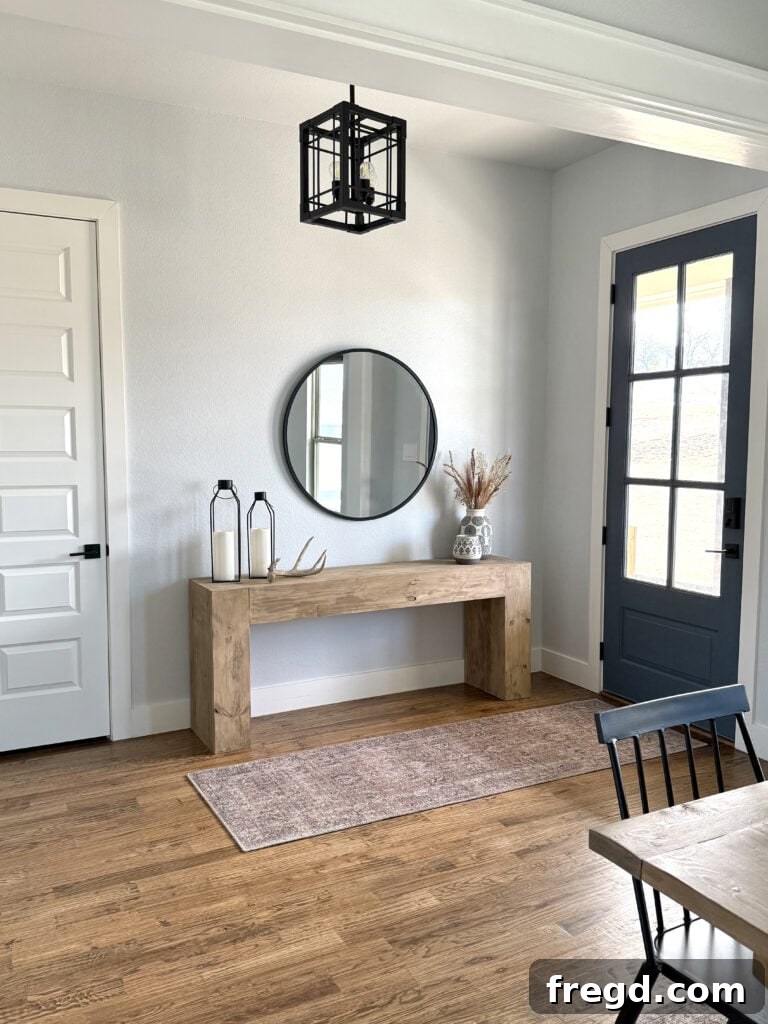Wide shot of entryway featuring console table and decor