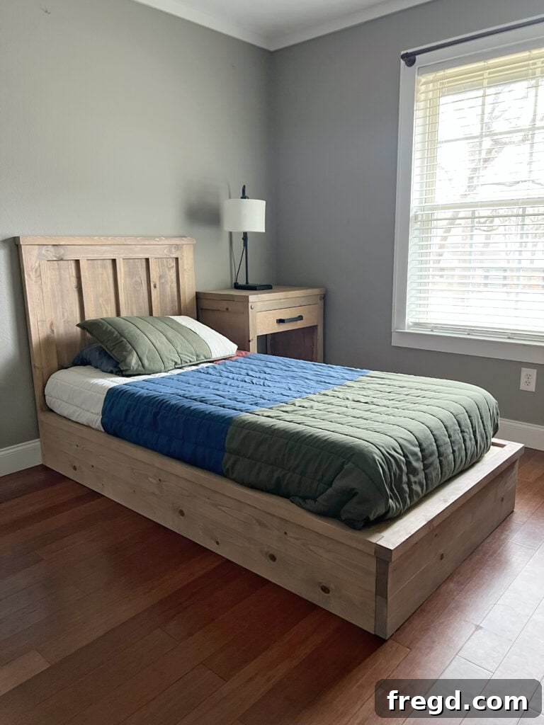 Build Your Own Twin Platform Bed 2 A beautifully crafted DIY twin platform bed in a modern bedroom setting.