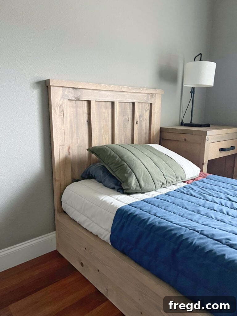Build Your Own Twin Platform Bed 19 Another perspective of the finished DIY twin platform bed, highlighting the wood grain.