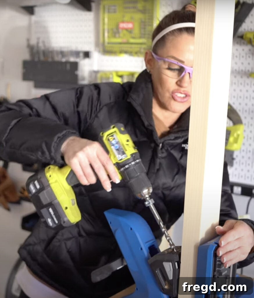 Build Your Own Twin Platform Bed 3 Close-up of a Kreg Jig 720 PRO in use, demonstrating pocket hole drilling.