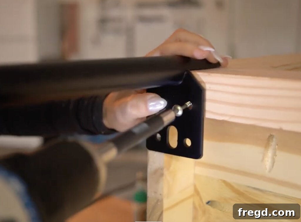 Crafting a Rustic Modern Nightstand 23 Close-up of the metal feet installation