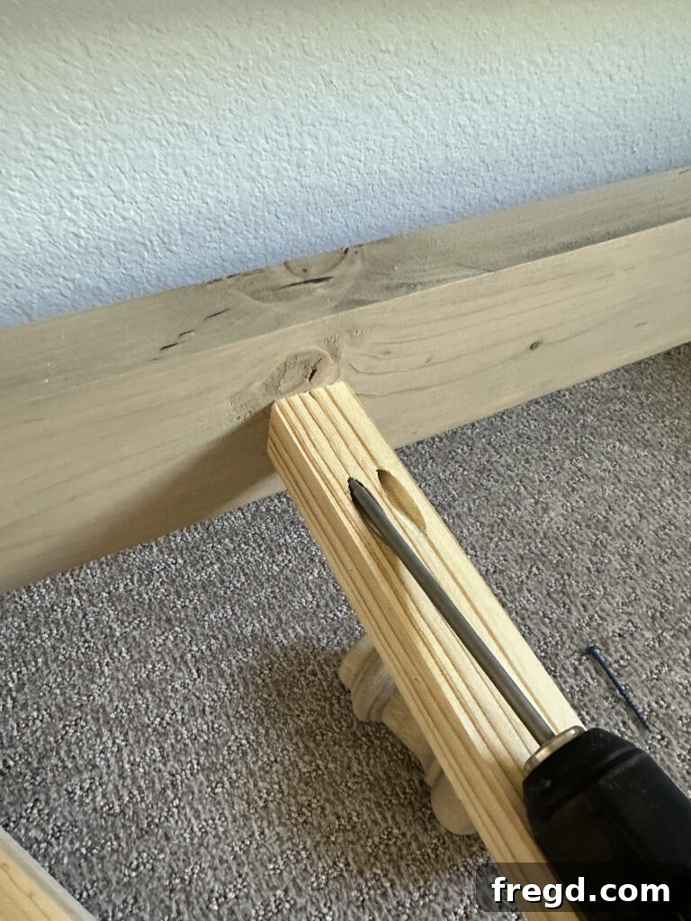 Attaching the side rails and middle support to the headboard