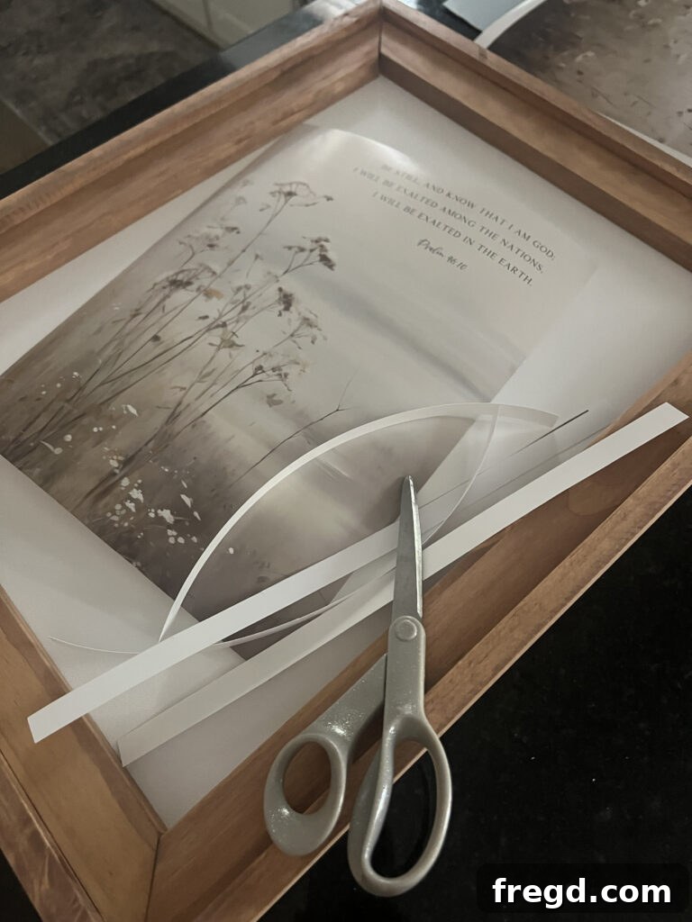 A freshly printed piece of botanical digital artwork, trimmed and ready to be placed in the frame.
