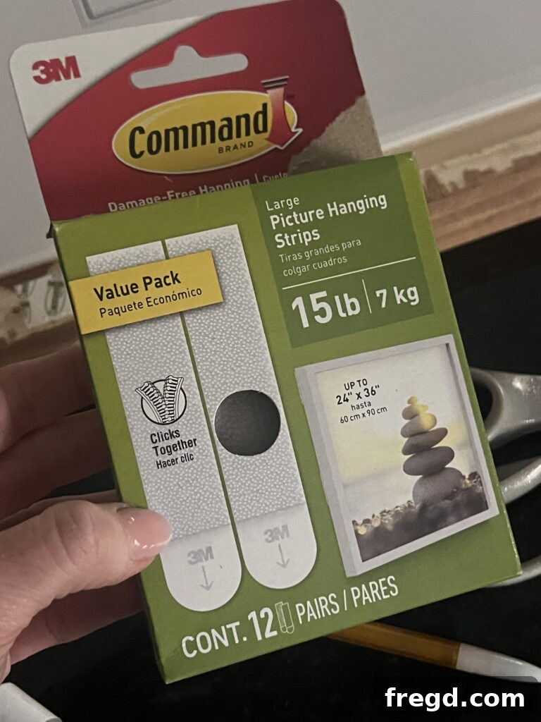 Command Picture Hanging Strips applied to the back of a wooden frame, ready for wall mounting.