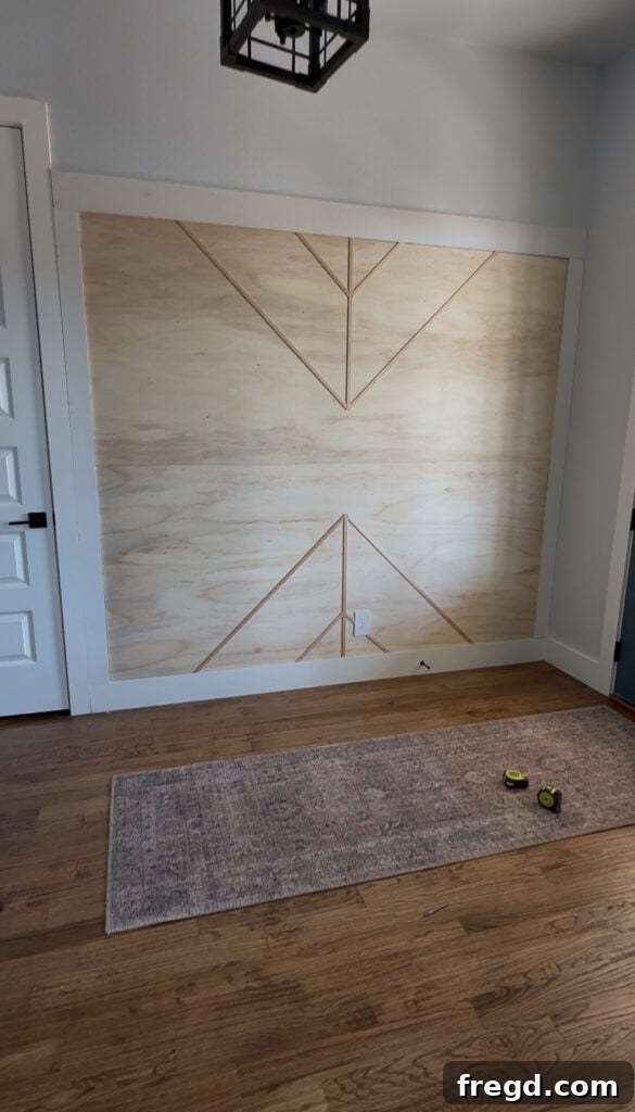 Removable Modern Accent Wall DIY for Renters 12 The evolving geometric pattern created by adding diagonal screen moulding pieces.