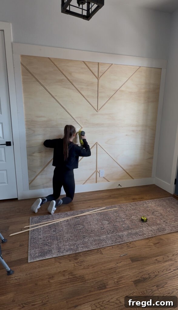 Removable Modern Accent Wall DIY for Renters 13 Completed geometric screen moulding pattern on the accent wall, ready for finishing.