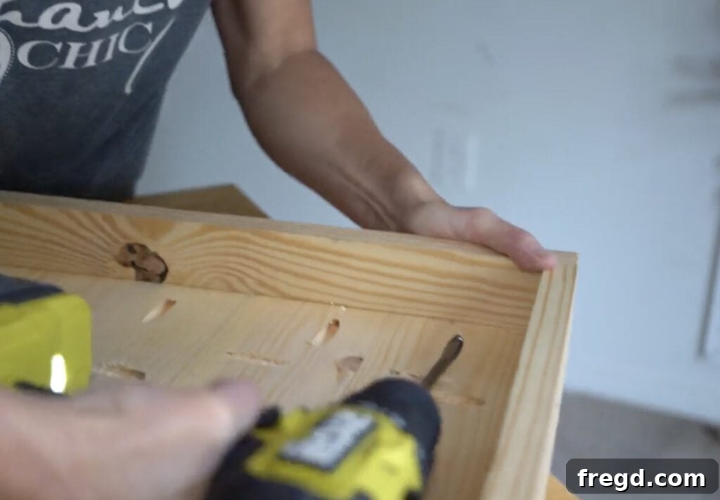 Attaching the side trim to the planter panel with pocket holes
