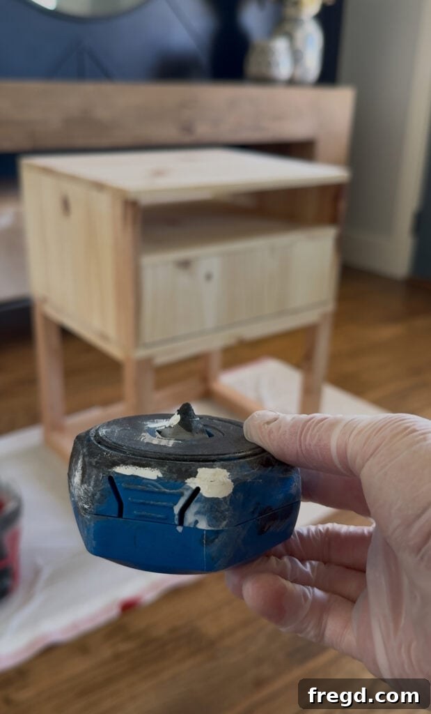 Easy Wood Nightstand Builds for Newbies 19 Nightstand propped up on Kreg Project Blocks for easier staining access.