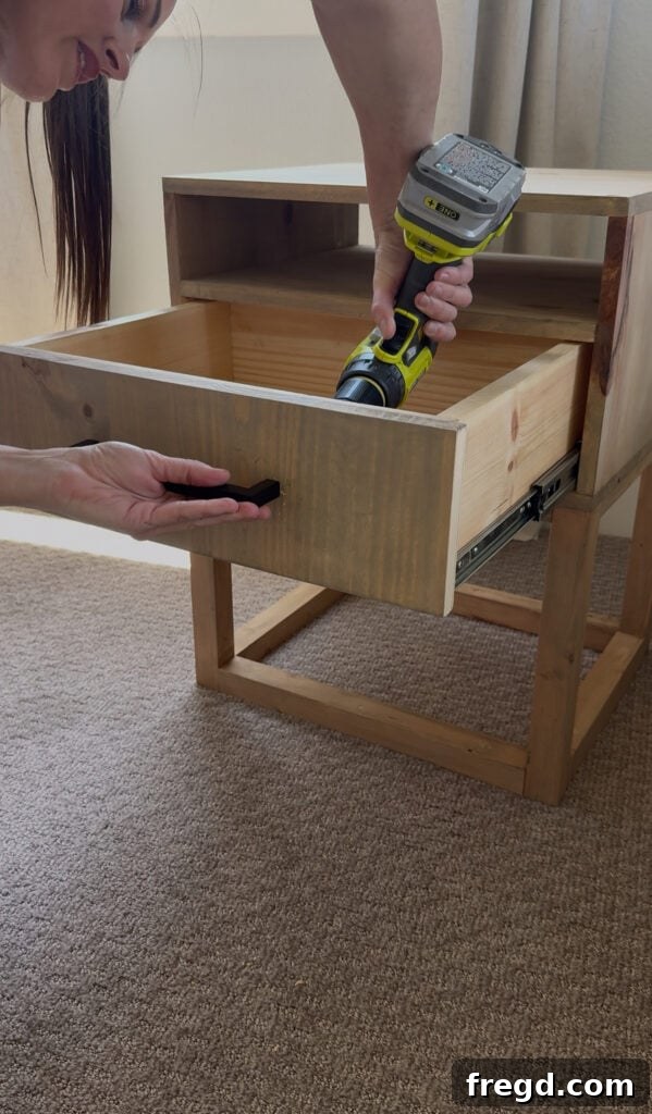 Easy Wood Nightstand Builds for Newbies 24 The completed DIY nightstand with a modern 7-inch drawer pull installed, showcasing the final look.