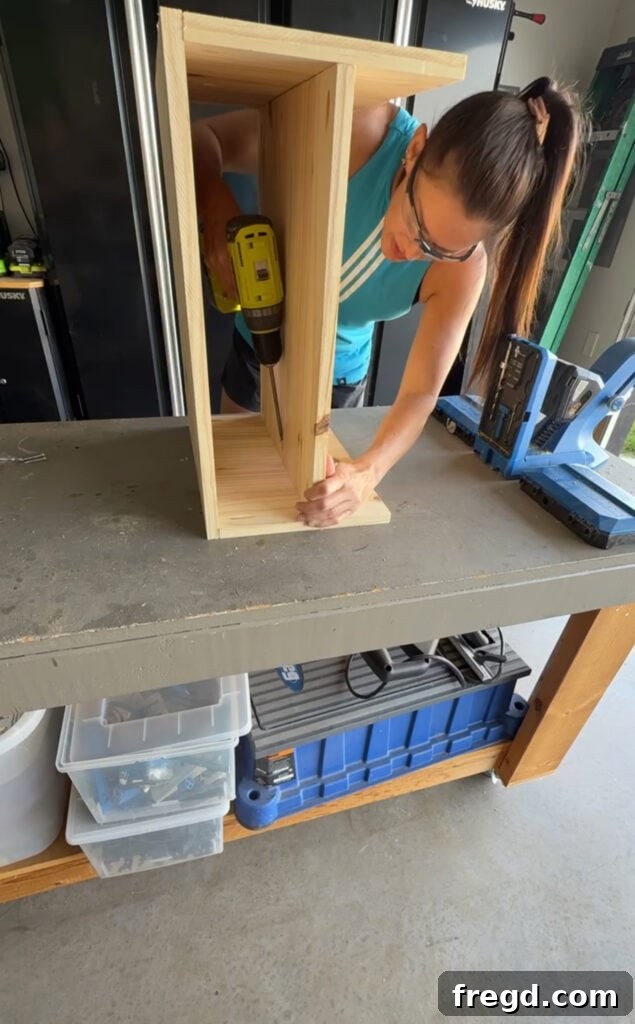 Easy Wood Nightstand Builds for Newbies 5 Nightstand frame with an internal shelf being installed using pocket hole screws.