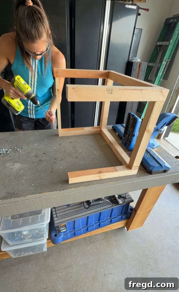 Easy Wood Nightstand Builds for Newbies 9 Top support pieces for the nightstand base being attached to the legs with pocket hole screws.