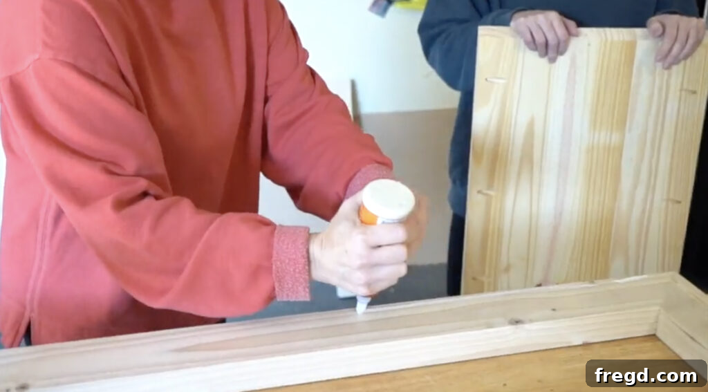 Modern Waterfall Console Build It Yourself for Less Than 100 Dollars 8 Drilling pocket holes into the console table top panel