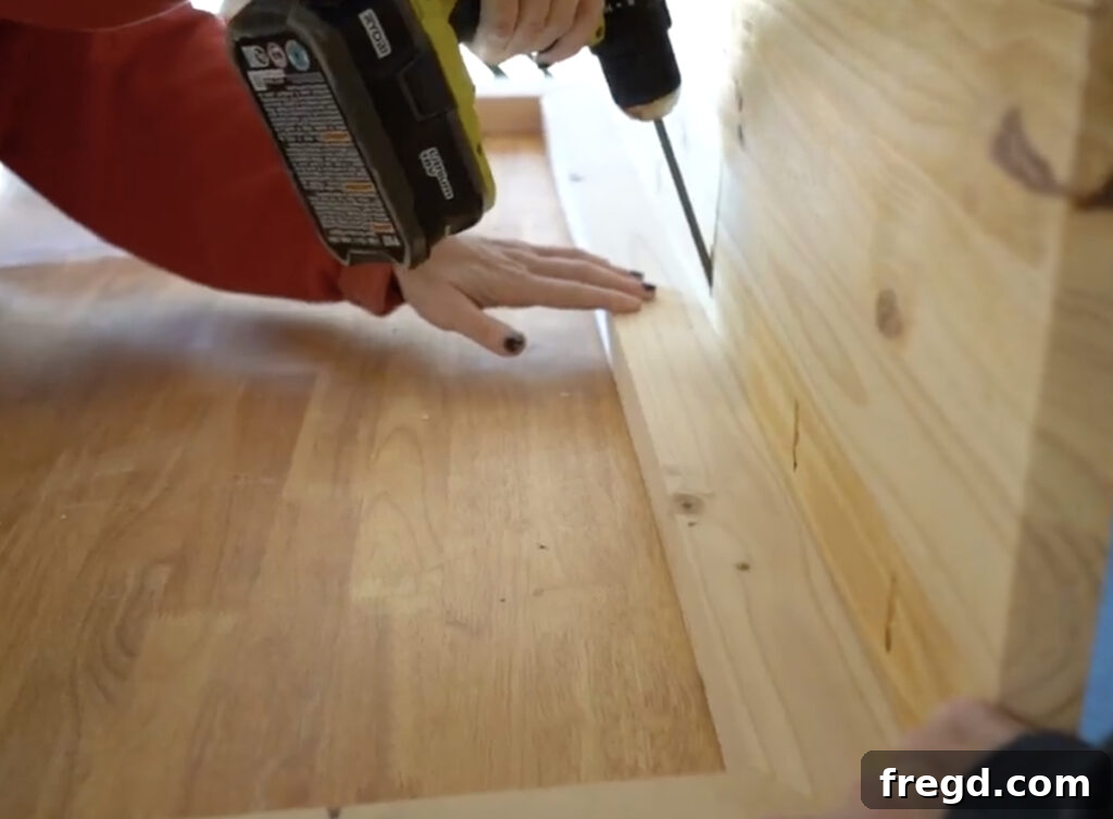 Modern Waterfall Console Build It Yourself for Less Than 100 Dollars 9 Applying wood glue to the frame for the console top