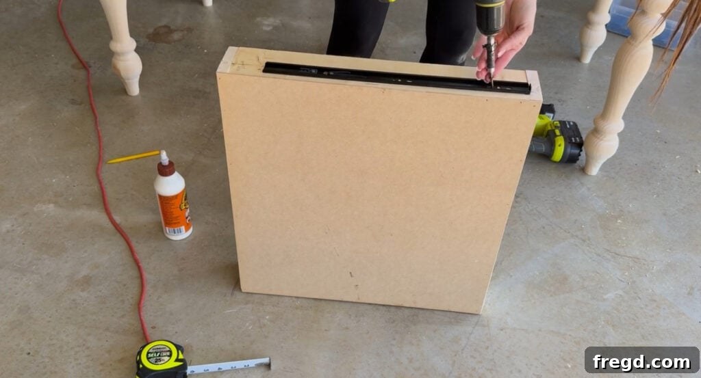 Installing drawer slides onto the desk frame
