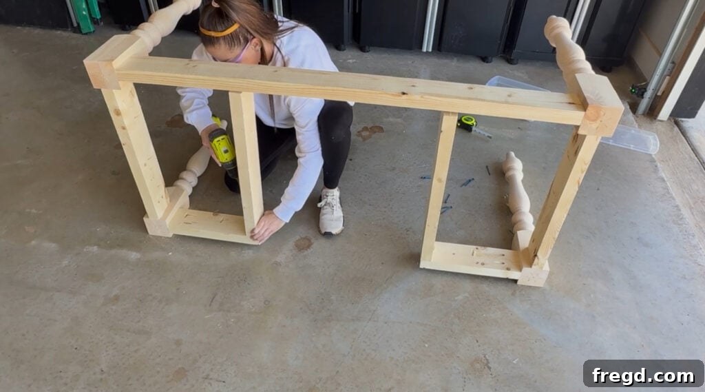 Adding support pieces between aprons of the desk base