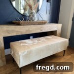 Modern rustic cowhide upholstered bench built with 2x4s and free plans.