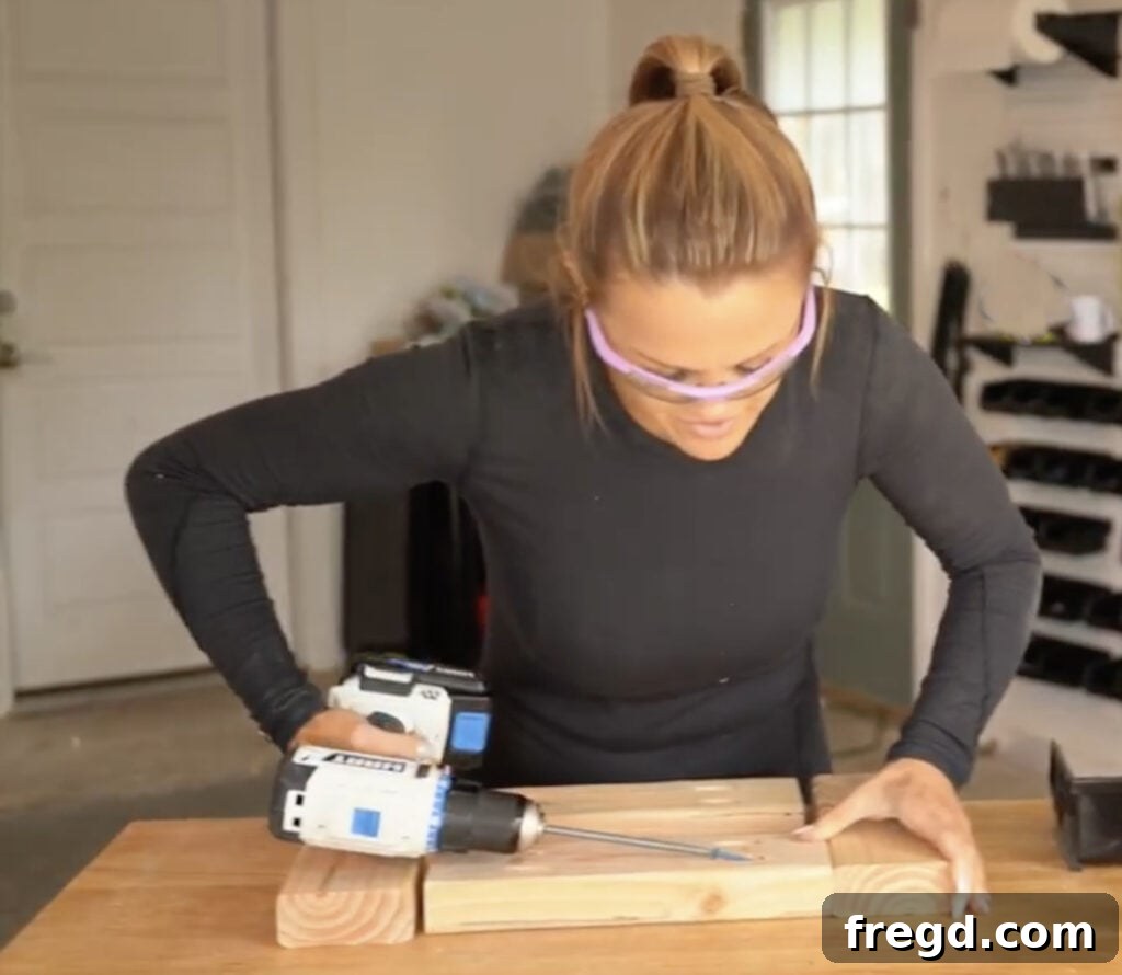 Assembling the sturdy side frame for a DIY cowhide bench, using 2x4 lumber and pocket hole joinery for a robust structure.