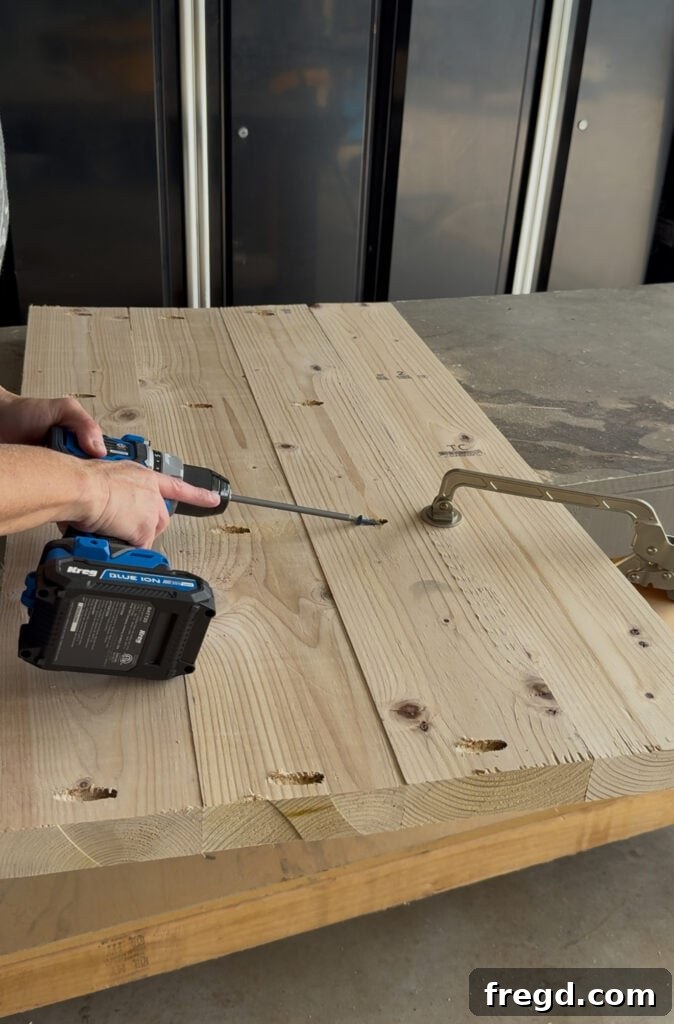 Assembling the thick, planked top for the cabinet using pocket holes and face clamps.
