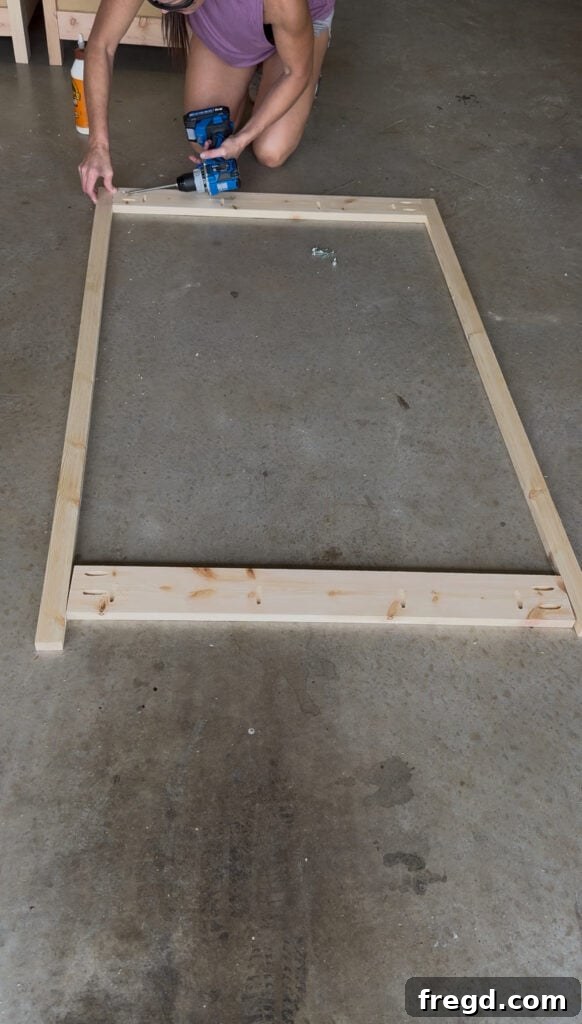 Assembling the hutch back frame using pocket holes and wood glue.