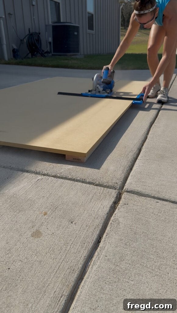 Cutting wood panels to size for the bookcase side panels.