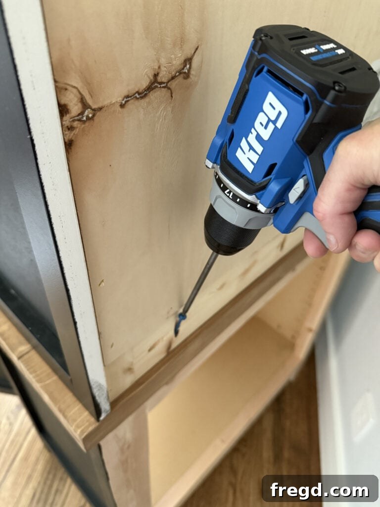 Securing the hutch to the cabinet base with pocket hole screws.