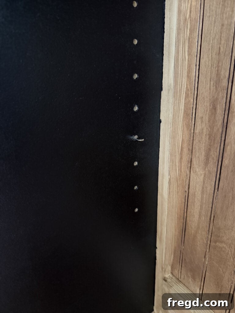 Installing adjustable shelves into the hutch with shelf pins.