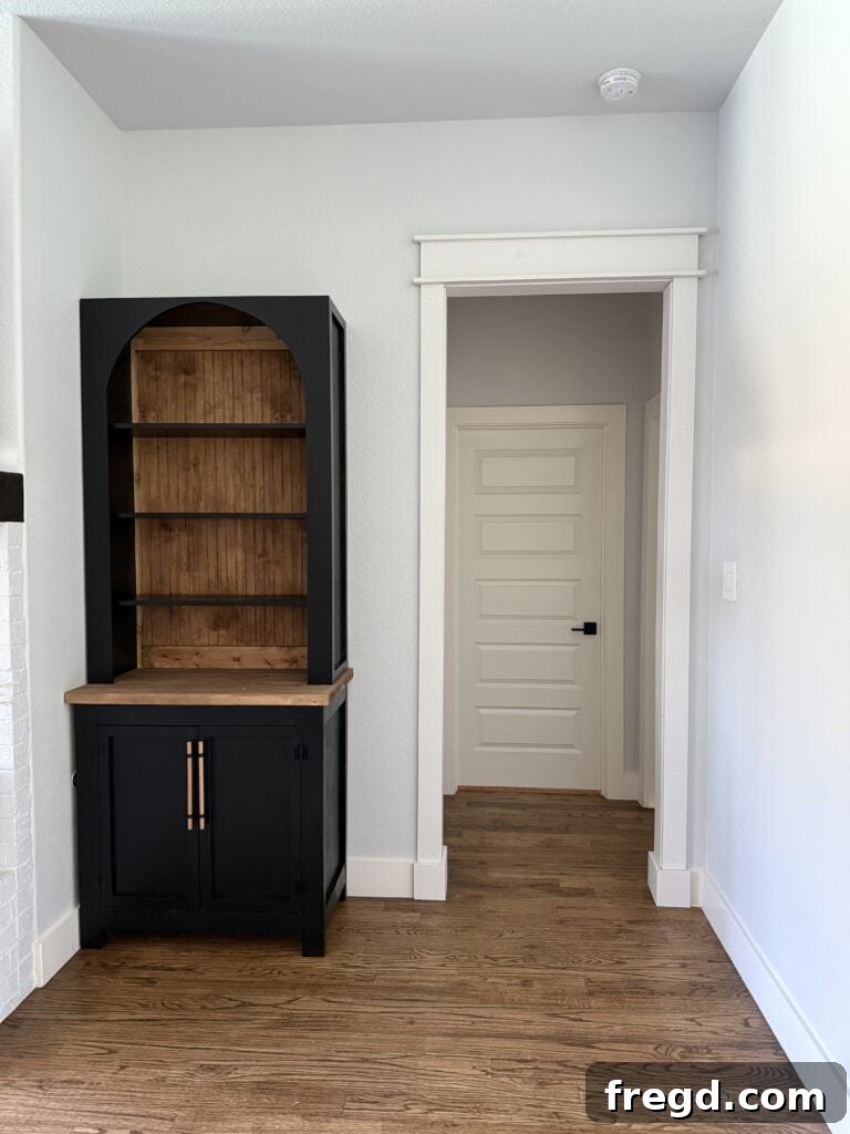 A close-up of the completed arched bookcase, ready for styling.