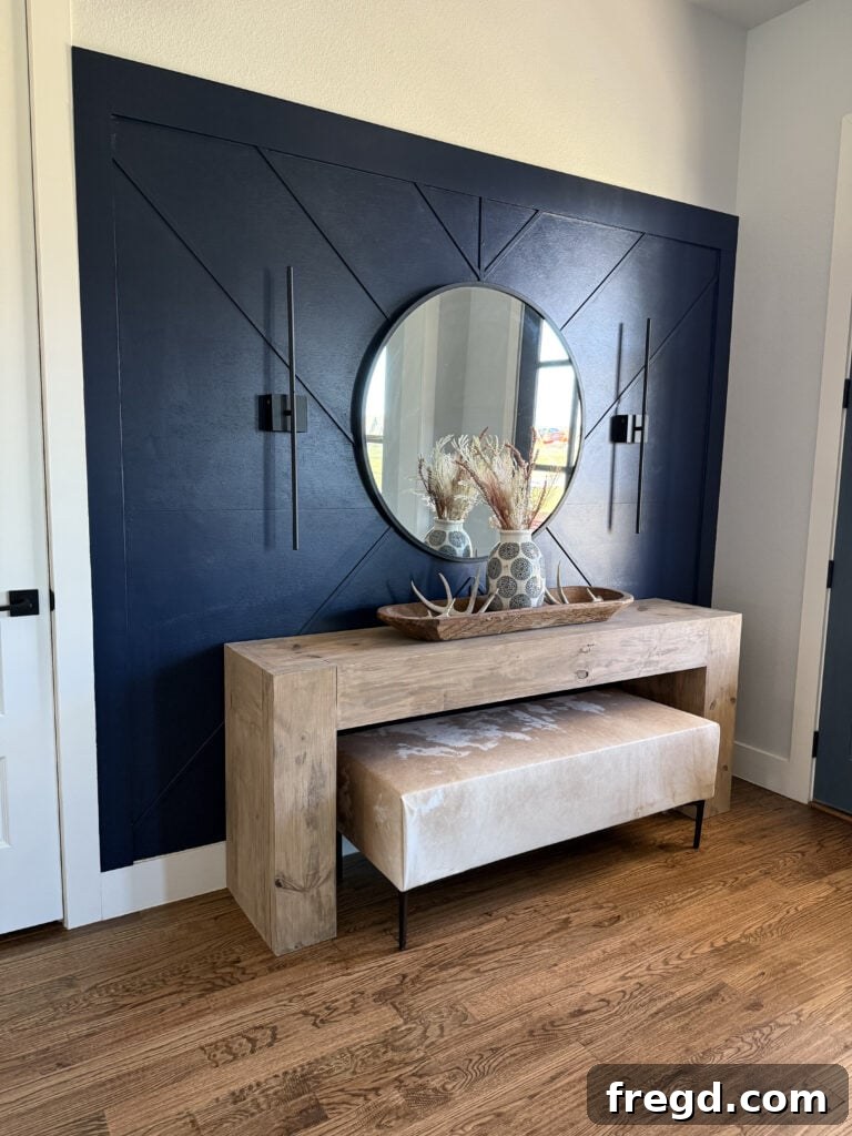 Modern farmhouse entryway styled with a DIY cowhide bench.
