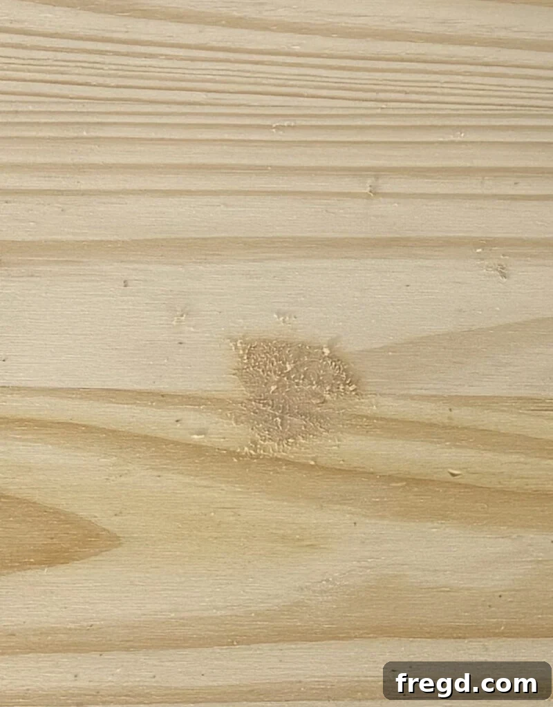 Filling the pivot hole with wood filler.