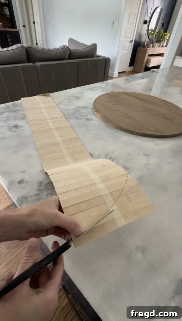 The pole wrap being carefully cut with scissors.