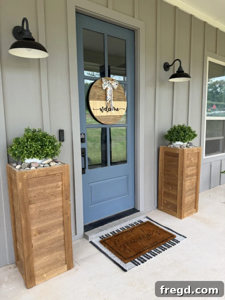 The finished DIY door hanger displayed on a front door.
