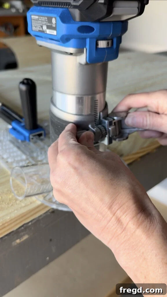 Close-up of the router's depth adjustment mechanism.